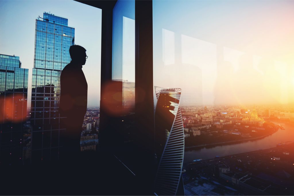 person looking atop a skyscraper